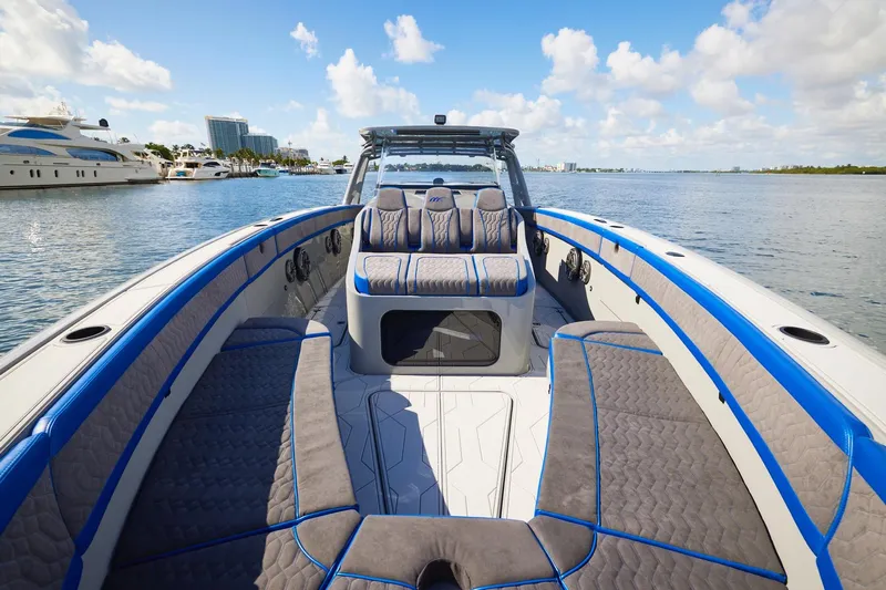  Yacht Photos Pics 2023 Midnight Express 43 Solstice boat with luxurious seating on calm water.