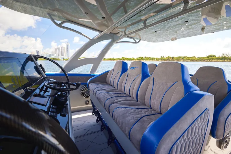  Yacht Photos Pics Luxurious interior of 2023 Midnight Express 43 Solstice yacht with plush seating and modern controls.