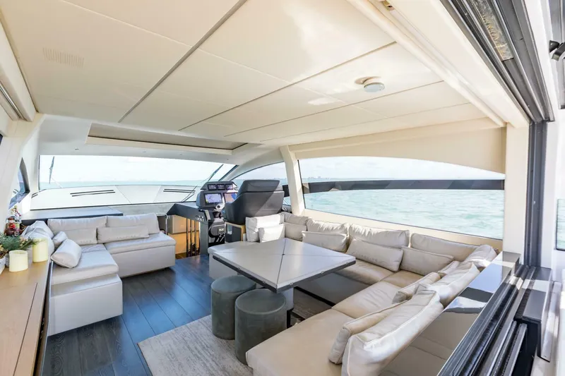 Pershing 70 White Yacht Photos Pics Luxurious interior of a 2016 Pershing 70 yacht with elegant seating and ocean view.