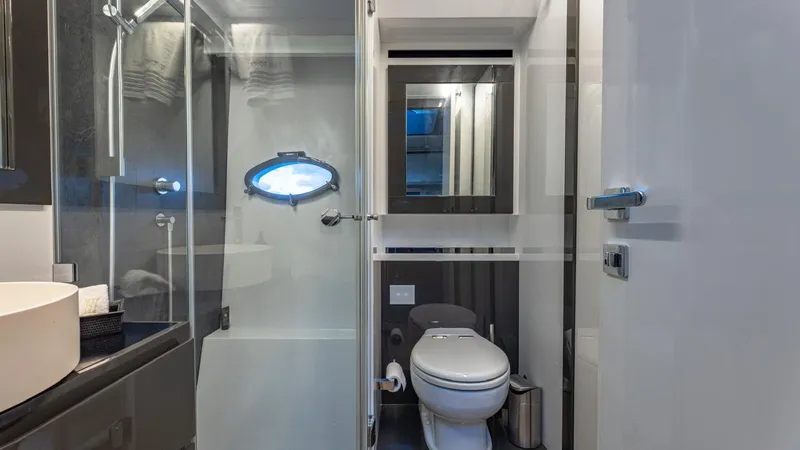 Pershing 70 White Yacht Photos Pics Luxurious bathroom in a 2016 Pershing 70 yacht, featuring modern fixtures and sleek design.