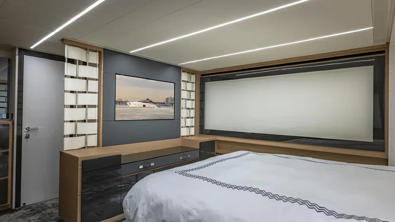 Pershing 70 White Yacht Photos Pics Luxurious bedroom interior of 2016 Pershing 70 yacht with modern design and elegant decor.