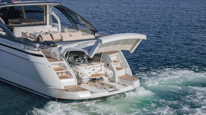 Pershing 70 White Yacht Photos Pics 2016 Pershing 70 yacht with open garage, showcasing luxury design on the water.