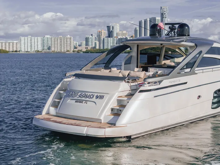 Pershing 70 White Yacht Photos Pics 2016 Pershing 70 yacht docked with city skyline in background.
