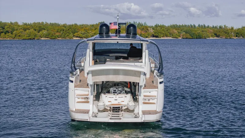 Pershing 70 White Yacht Photos Pics 2016 Pershing 70 yacht on water, rear view with open engine compartment.