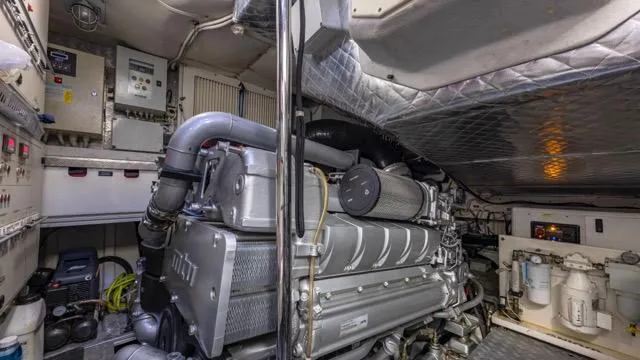 Pershing 70 White Yacht Photos Pics Engine room of a 2016 Pershing 70 yacht, showcasing machinery and equipment.