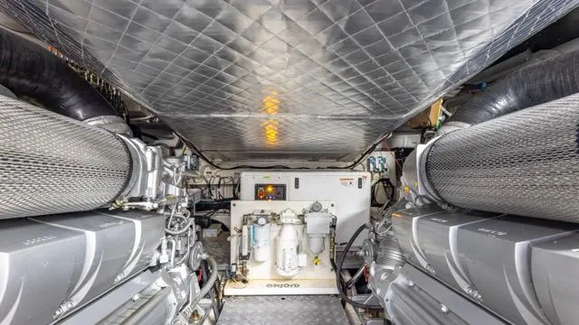 Pershing 70 White Yacht Photos Pics Engine room of a 2016 Pershing 70 yacht, featuring advanced machinery and equipment.