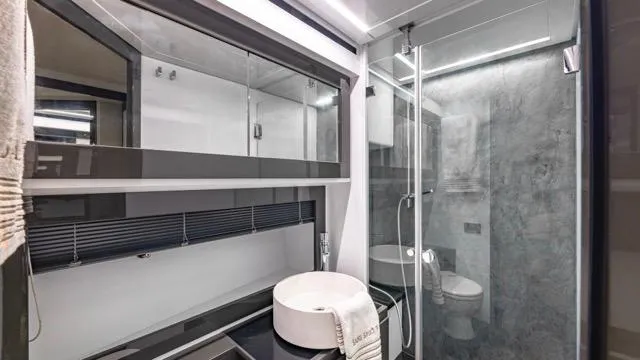 Pershing 70 White Yacht Photos Pics Luxurious bathroom in a 2016 Pershing 70 yacht with modern fixtures and sleek design.