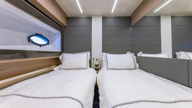 Pershing 70 White Yacht Photos Pics Luxurious twin cabin interior on a 2016 Pershing 70 yacht, featuring modern design and comfort.