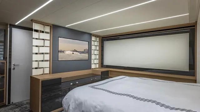 Pershing 70 White Yacht Photos Pics Luxurious bedroom interior of 2016 Pershing 70 yacht with modern design and elegant decor.