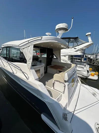  Yacht Photos Pics 2020 Regal 38 Grande Coupe yacht docked at marina, featuring sleek design and spacious deck.