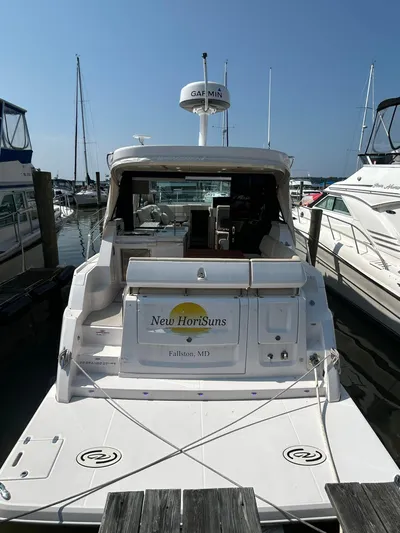  Yacht Photos Pics 2020 Regal 38 Grande Coupe docked at marina, rear view, sunny day.