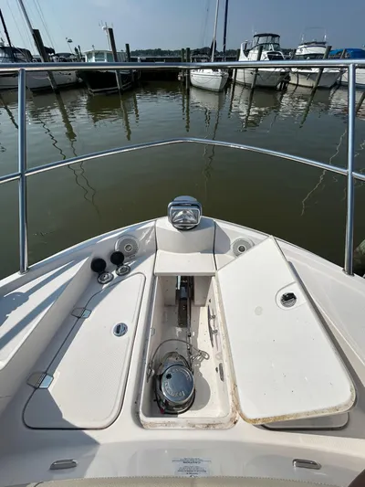  Yacht Photos Pics Bow view of 2020 Regal 38 Grande Coupe at marina, showcasing anchor and deck details.