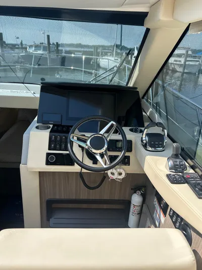  Yacht Photos Pics 2020 Regal 38 Grande Coupe helm with modern controls and navigation system.