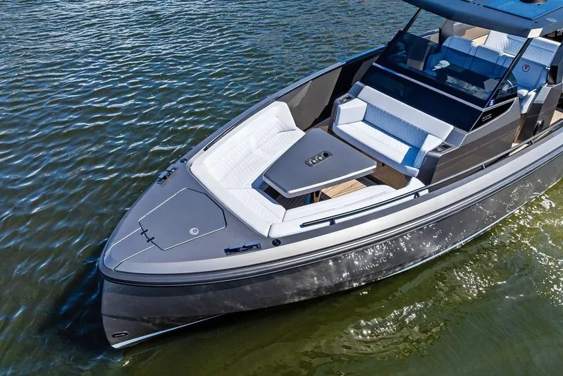 Not His Yacht Photos Pics 2024 Vanquish Yachts 40 on water, showcasing sleek design and luxurious seating.