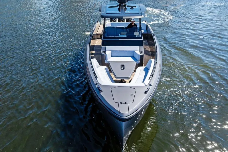 Not His Yacht Photos Pics 2024 Vanquish Yachts 40 cruising on water, showcasing sleek design and luxury features.