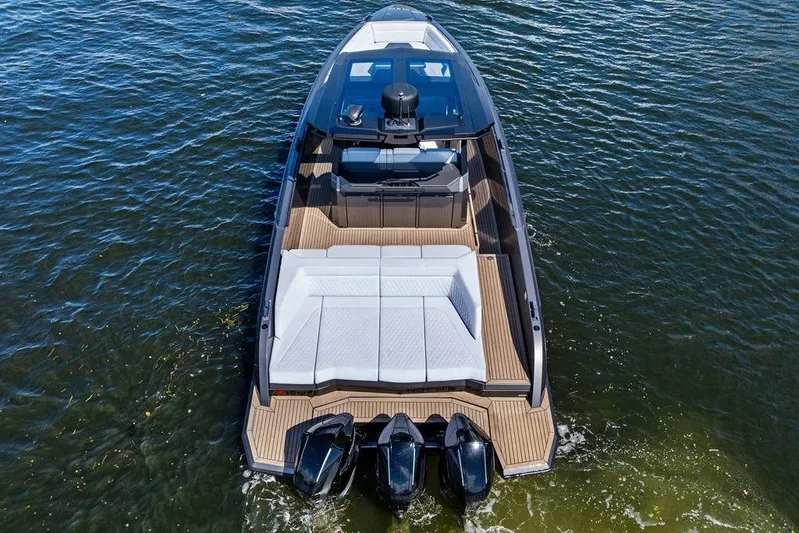Not His Yacht Photos Pics 2024 Vanquish Yachts 40 on water, showcasing sleek design and powerful engines.