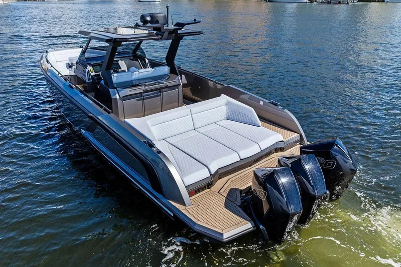 Not His Yacht Photos Pics 2024 Vanquish Yachts 40 on water, featuring sleek design and powerful engines.