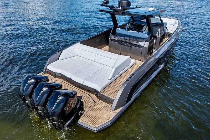 Not His Yacht Photos Pics 2024 Vanquish Yachts 40 with triple engines, sleek design, and luxurious seating on water.