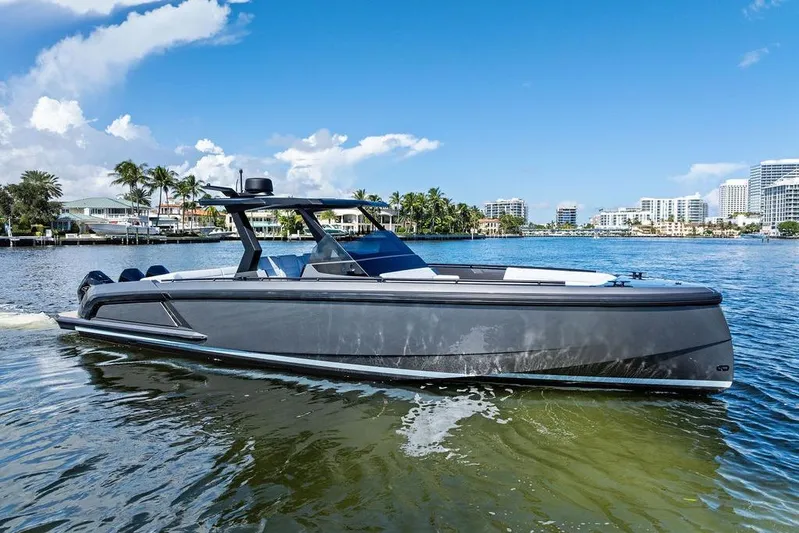 Not His Yacht Photos Pics 2024 Vanquish Yachts 40 on water, sleek design, modern cityscape background.