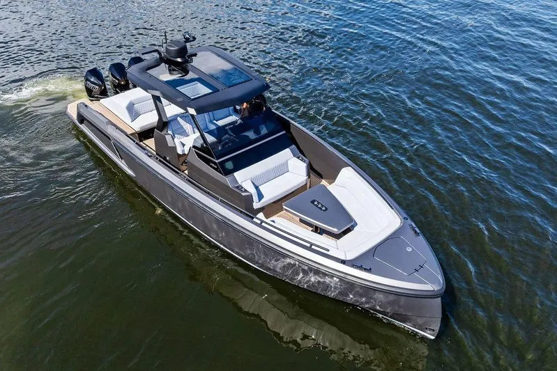 Not His Yacht Photos Pics 2024 Vanquish Yachts 40 cruising on open water, showcasing sleek design and luxury features.