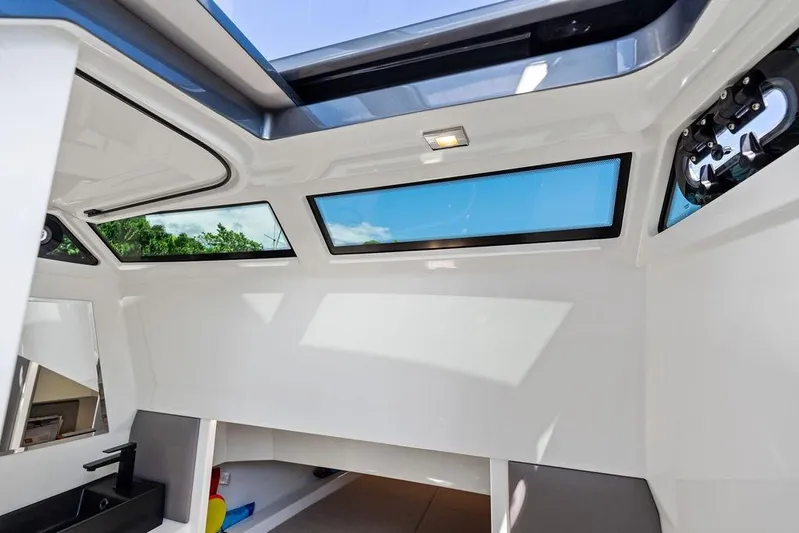 Not His Yacht Photos Pics Interior view of 2024 Vanquish Yachts 40, featuring sleek design and skylight windows.