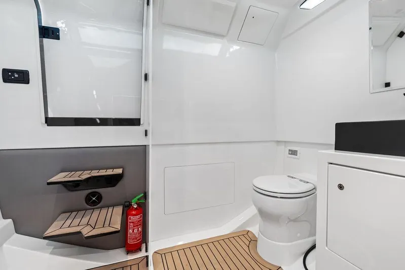Not His Yacht Photos Pics 2024 Vanquish Yachts 40 interior bathroom with modern design and wooden flooring.