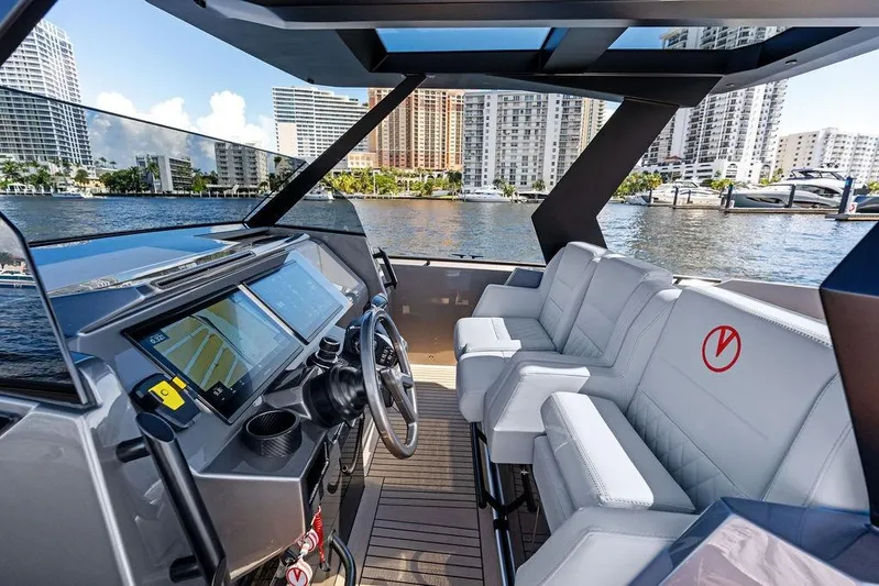 Not His Yacht Photos Pics 2024 Vanquish Yachts 40 interior with modern dashboard and luxurious seating.