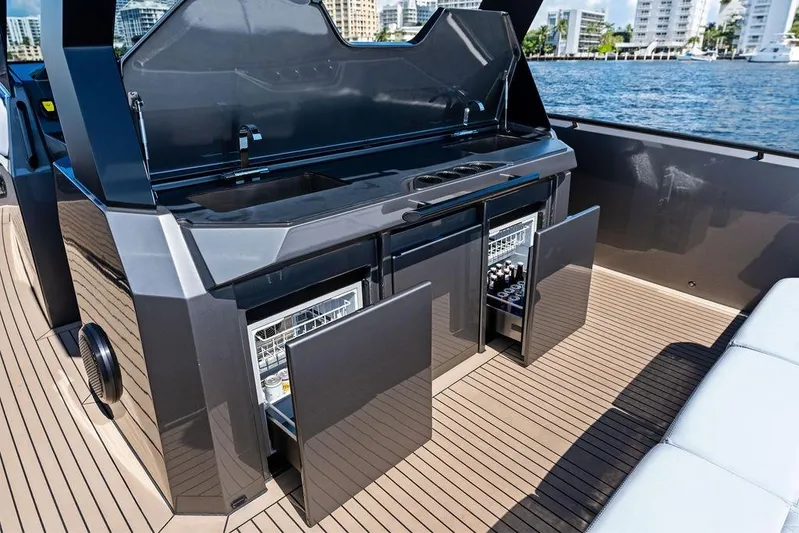 Not His Yacht Photos Pics Luxury outdoor kitchen on 2024 Vanquish Yachts 40, featuring sleek cabinetry and modern appliances.