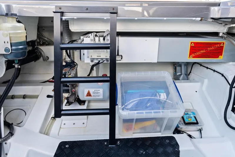 Not His Yacht Photos Pics Engine compartment of 2024 Vanquish Yachts 40, featuring equipment and storage.