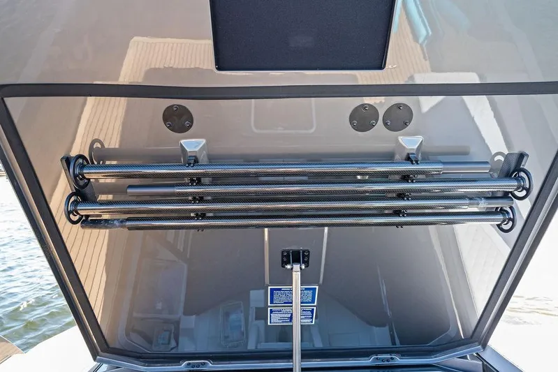 Not His Yacht Photos Pics 2024 Vanquish Yachts 40, sleek carbon fiber detailing, open hatch view.