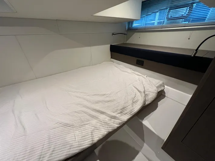  Yacht Photos Pics 2025 Beneteau Gran Turismo 36 cabin interior with bed and window blinds.
