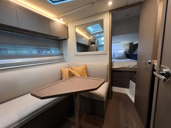  Yacht Photos Pics Interior of 2025 Beneteau Gran Turismo 36 yacht, featuring cozy seating and modern design.