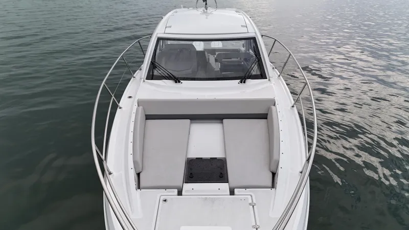  Yacht Photos Pics 2025 Beneteau Gran Turismo 36 yacht on calm water, showcasing sleek design and spacious deck.