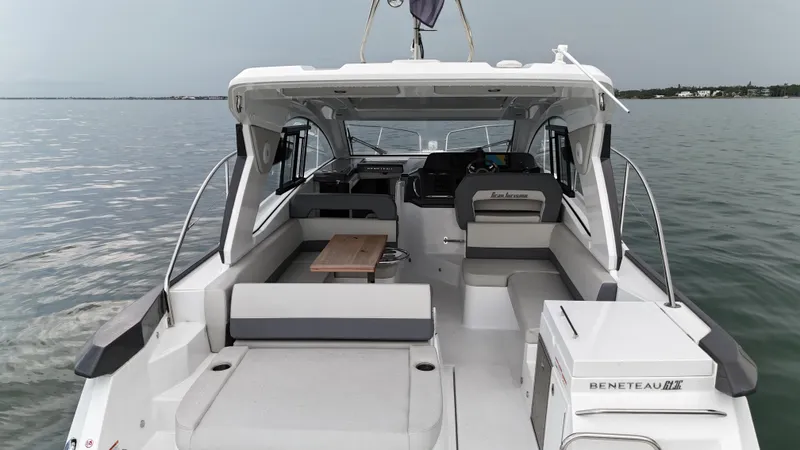  Yacht Photos Pics 2025 Beneteau Gran Turismo 36 yacht interior with seating and table on calm water.