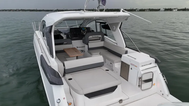  Yacht Photos Pics 2025 Beneteau Gran Turismo 36 yacht with spacious seating on calm water.