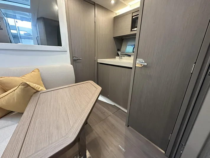  Yacht Photos Pics Interior of 2025 Beneteau Gran Turismo 36 yacht, featuring modern kitchen and seating area.