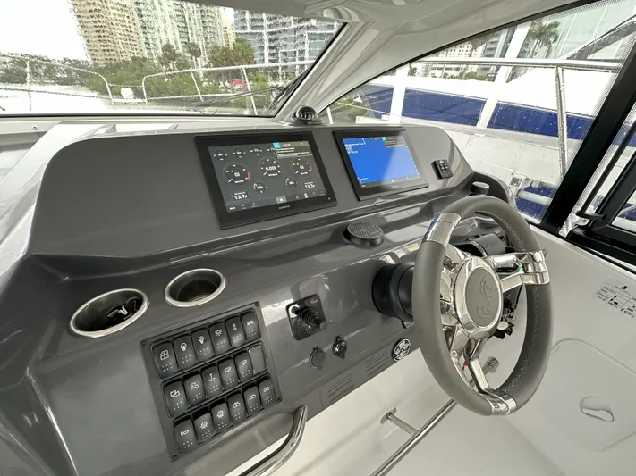  Yacht Photos Pics 2025 Beneteau Gran Turismo 36 helm with modern controls and navigation displays.