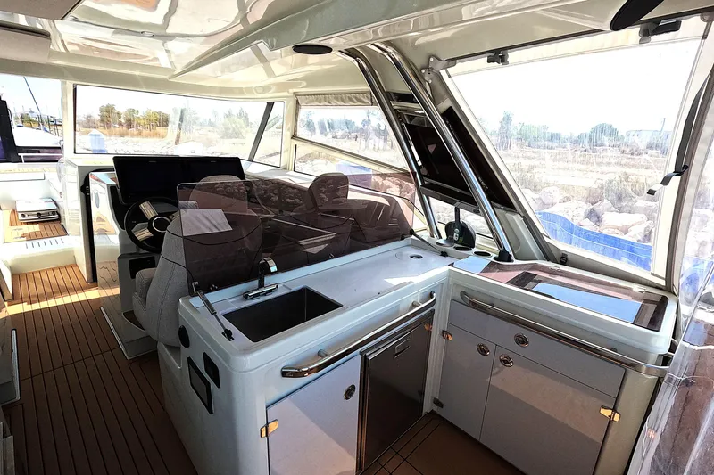  Yacht Photos Pics Luxurious interior of 2025 Catana YOT 41 yacht with modern helm and kitchen area.