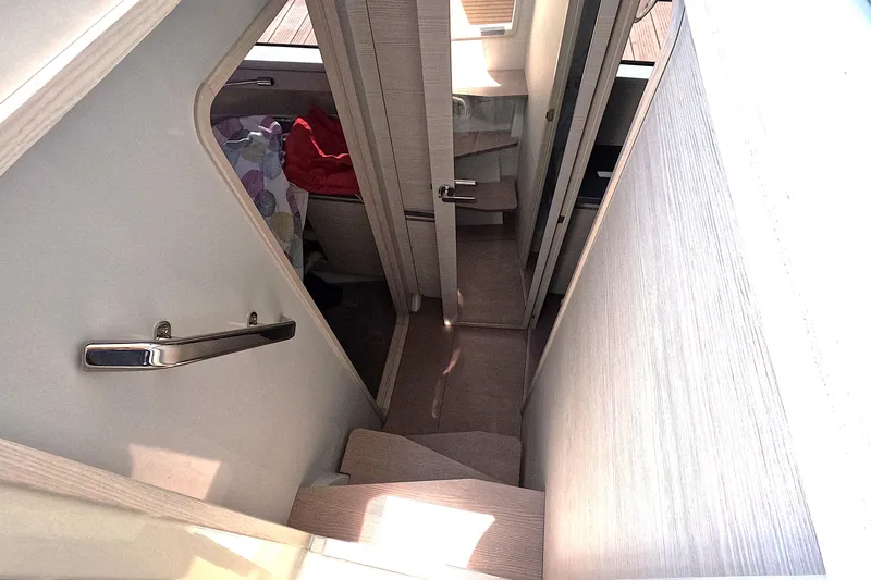  Yacht Photos Pics Interior stairs of 2025 Catana YOT 41 yacht, featuring modern design and wooden finish.