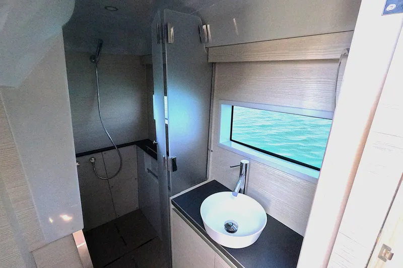  Yacht Photos Pics Modern bathroom interior of 2025 Catana YOT 41 yacht with sleek design and ocean view.