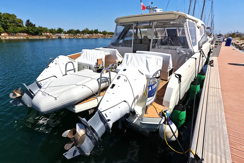  Yacht Photos Pics 2025 Catana YOT 41 yacht docked, featuring dual outboard motors and sleek design.