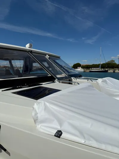  Yacht Photos Pics 2025 YOT 41 boat docked under clear blue sky.