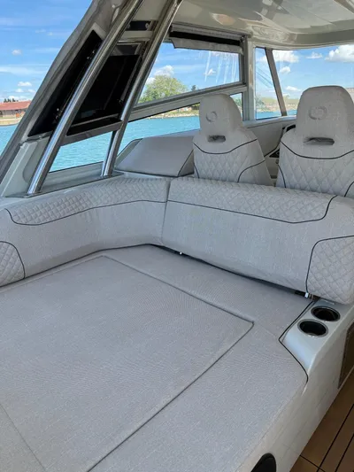  Yacht Photos Pics Luxurious interior of 2025 YOT 41 yacht with plush seating and scenic water view.