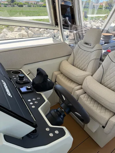  Yacht Photos Pics Luxury interior of 2025 YOT 41 boat with plush seating and advanced controls.