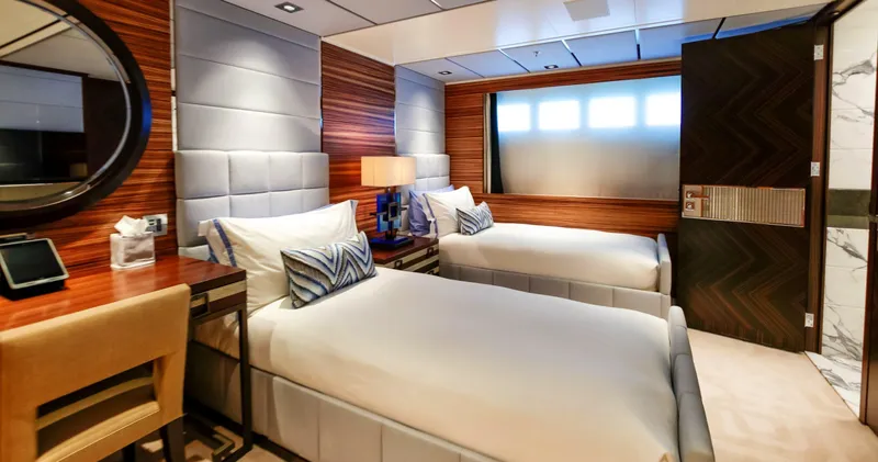 W Yacht Photos Pics Luxurious twin bedroom on 2013 Feadship yacht, featuring modern decor and elegant furnishings.
