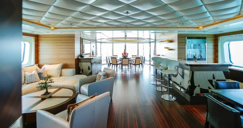 W Yacht Photos Pics Luxurious 2013 Feadship yacht interior with elegant seating, bar, and dining area.