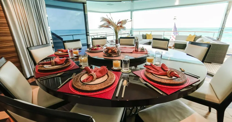 W Yacht Photos Pics Luxurious dining setup on 2013 Feadship yacht with ocean view.