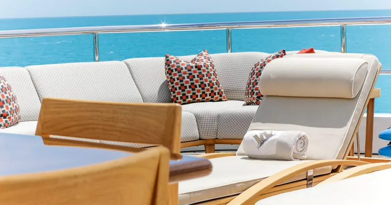 W Yacht Photos Pics Luxurious Feadship yacht deck with lounge chairs, cushions, and ocean view, 2013 model.