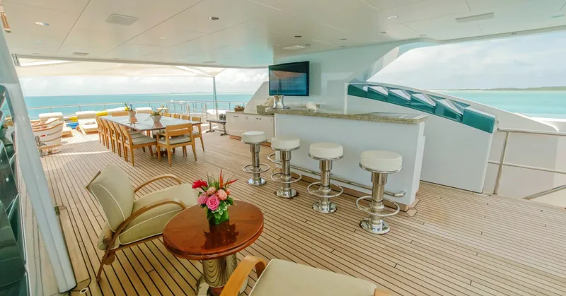 W Yacht Photos Pics Luxurious 2013 Feadship yacht deck with bar, seating, and ocean view.
