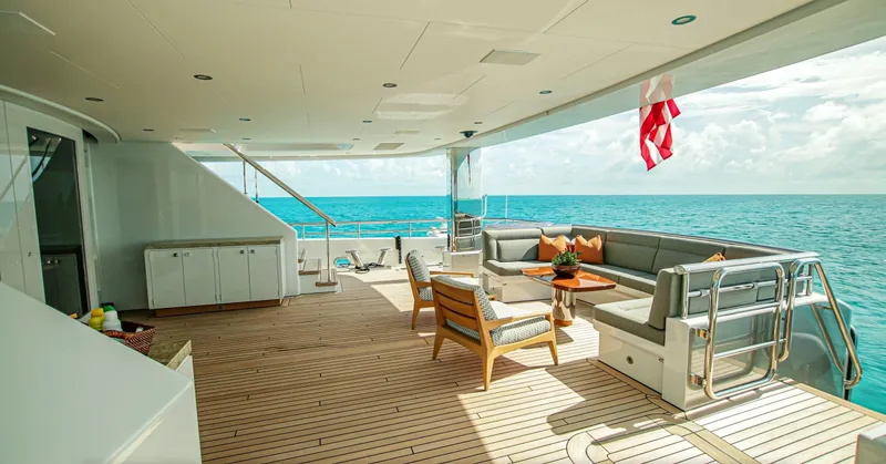 W Yacht Photos Pics Luxurious 2013 Feadship yacht deck with seating, ocean view, and elegant design.